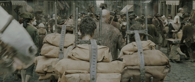 Wide shot frame from Perfume: The Story of a Murderer — walking, street, person
