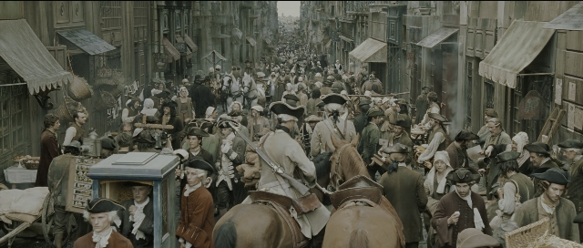 Wide shot frame from Perfume: The Story of a Murderer — walking, street, hat