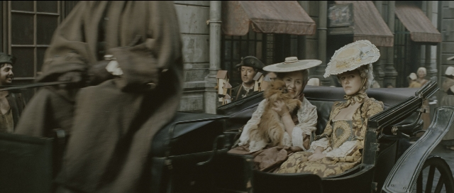 Wide shot frame from Perfume: The Story of a Murderer — sitting, walking, street