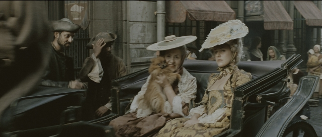 Wide shot frame from Perfume: The Story of a Murderer — sitting, standing, street