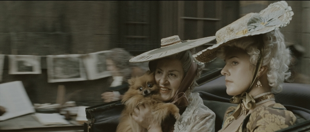 Wide shot frame from Perfume: The Story of a Murderer — sitting, table, hat