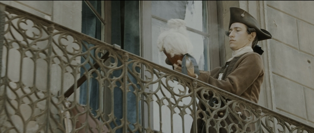 Wide shot frame from Perfume: The Story of a Murderer — standing, hat, coat