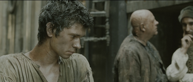 Wide shot frame from Perfume: The Story of a Murderer — standing, room, shirt