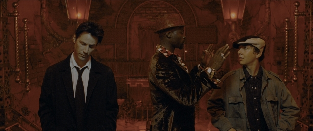 Wide shot frame from Constantine — standing, room, dialogue
