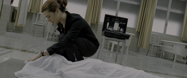 Wide shot frame from Constantine — room, table, mirror