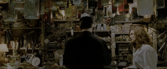 Wide shot frame from Constantine — standing, room, dialogue
