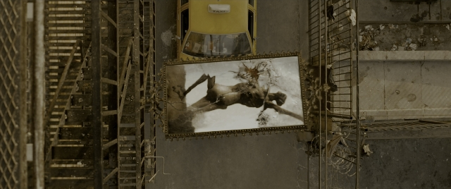 Wide shot frame from Constantine — coat, person, picture frame