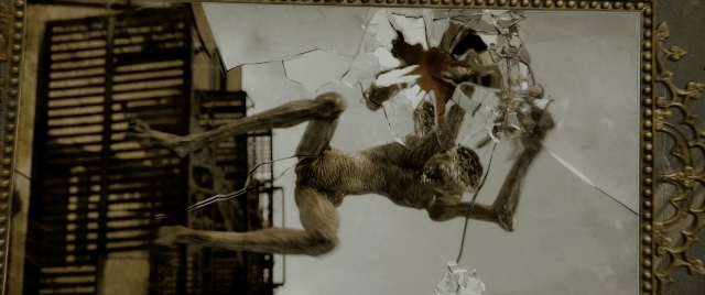 Wide shot frame from Constantine — monkey, glass, window