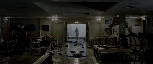 Wide shot frame from Constantine — standing, room, bed