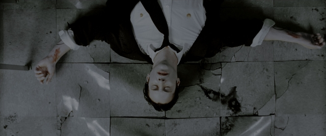 Wide shot frame from Constantine — shirt, person, human face