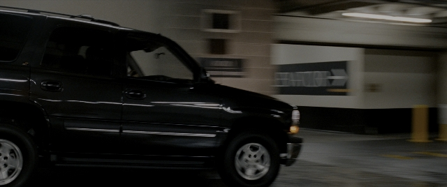 Wide shot frame from Constantine — car, wheel, window