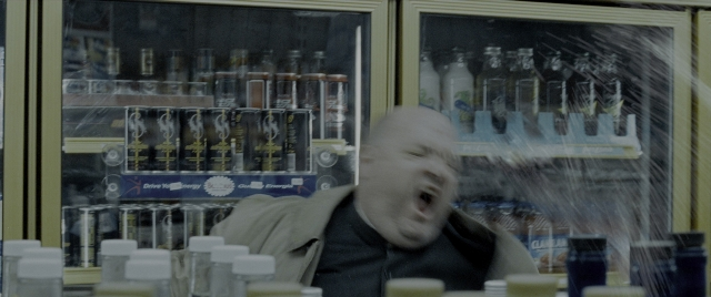 Wide shot frame from Constantine — standing, face, glass