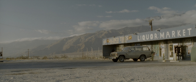 Frame from Constantine — car, wheel, building