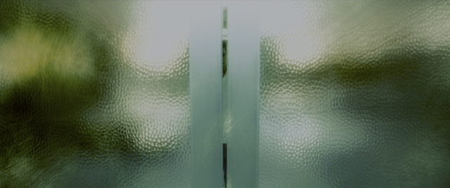 Wide shot frame from Constantine — curtain, window, running