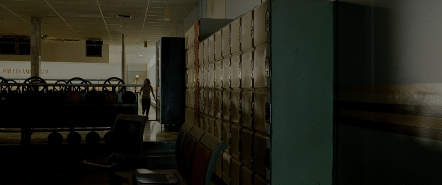 Wide shot frame from Constantine — walking, room, furniture