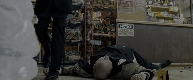 Wide shot frame from Constantine — standing, person, footwear
