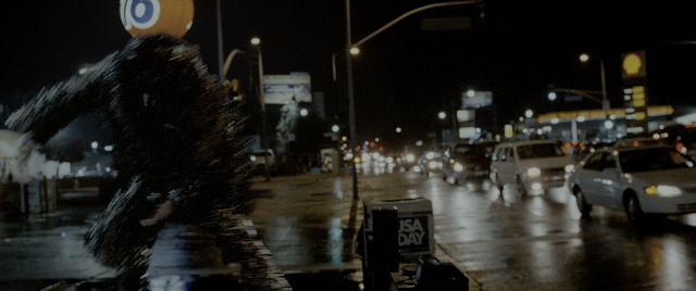 Wide shot frame from Constantine — walking, street, car