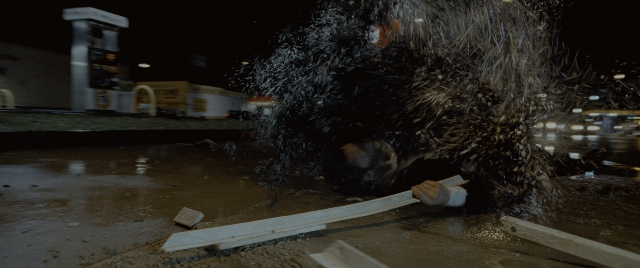 Wide shot frame from Constantine — hand, night, water