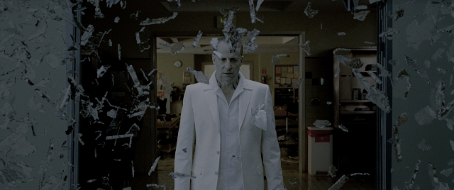 Wide shot frame from Constantine — standing, room, dialogue
