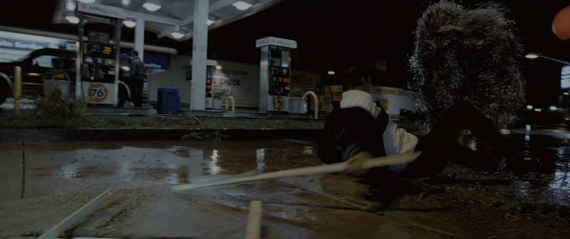 Wide shot frame from Constantine — night, water, person