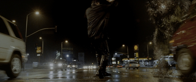 Wide shot frame from Constantine — walking, street, hand