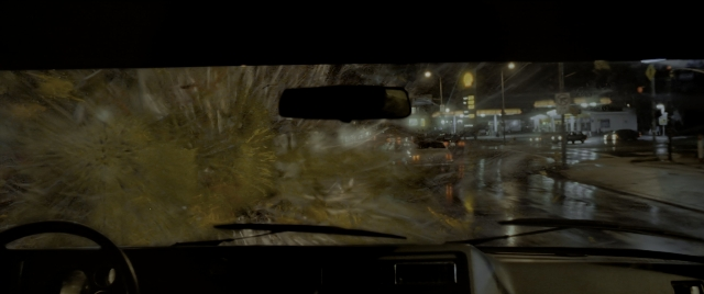Wide shot frame from Constantine — street, car, night