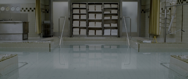 Wide shot frame from Constantine — mirror, water, furniture