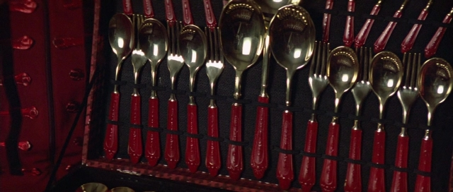 Frame from The Cook, the Thief, His Wife & Her Lover — spoon, fork