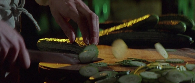 Frame from The Cook, the Thief, His Wife & Her Lover — kitchen, hand, knife
