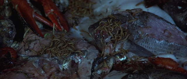 Wide shot frame from The Cook, the Thief, His Wife & Her Lover — seafood