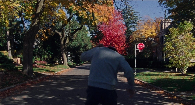 Wide shot frame from Dream Scenario — walking, street, person
