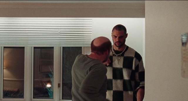 Wide shot frame from Dream Scenario — standing, room, face