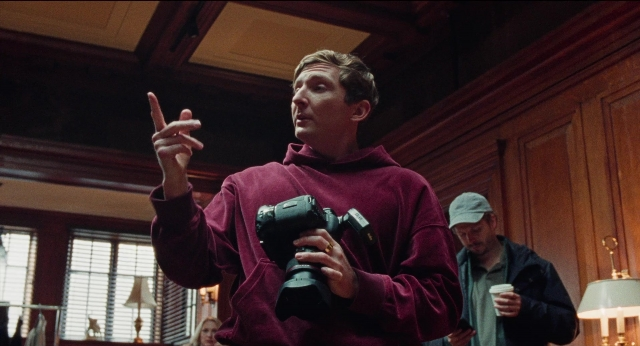 Wide shot frame from Dream Scenario — standing, room, dialogue