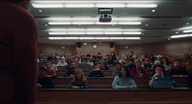 Wide shot frame from Dream Scenario — sitting, room, dialogue