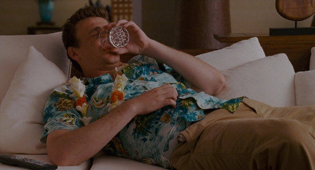 Wide shot frame from Forgetting Sarah Marshall — hand, shirt, couch
