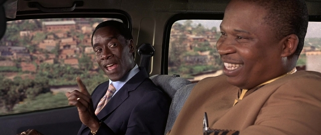 Wide shot frame from Hotel Rwanda — sitting, car, hand