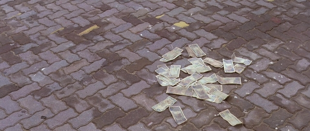 Frame from Hotel Rwanda — street, coin