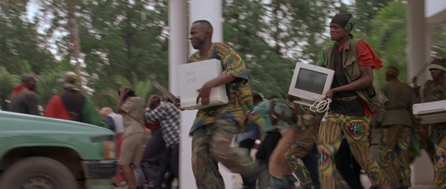 Wide shot frame from Hotel Rwanda — walking, street, person