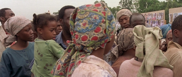 Wide shot frame from Hotel Rwanda — face, person, human face