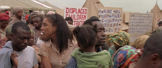 Wide shot frame from Hotel Rwanda — dialogue, shirt, face