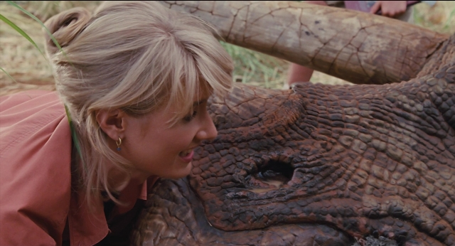 Wide shot frame from Jurassic Park — face, hair, elephant