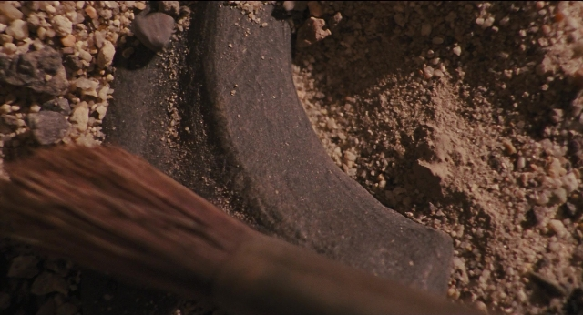 Wide shot frame from Jurassic Park — bed, animal
