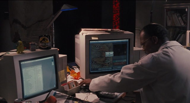 Wide shot frame from Jurassic Park — sitting, book, shirt