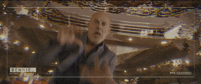 Wide shot frame from Kingsman: The Golden Circle — standing, suit, tie