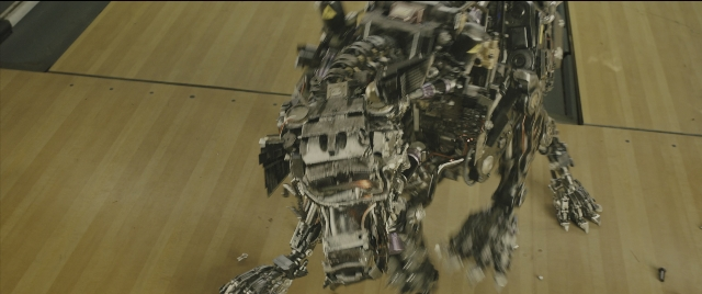 Wide shot frame from Kingsman: The Golden Circle — standing, toy