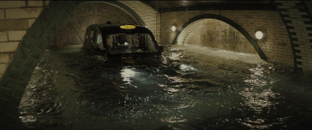 Wide shot frame from Kingsman: The Golden Circle — car, water, taxi