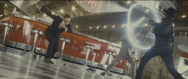 Wide shot frame from Kingsman: The Golden Circle — hand, suit, person