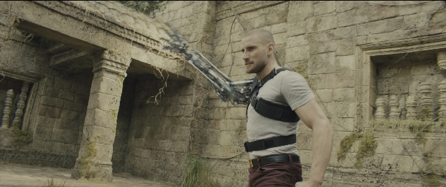 Wide shot frame from Kingsman: The Golden Circle — standing, hand, shirt