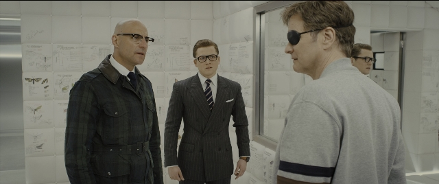 Wide shot frame from Kingsman: The Golden Circle — standing, room, dialogue