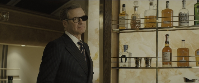 Wide shot frame from Kingsman: The Golden Circle — standing, suit, tie